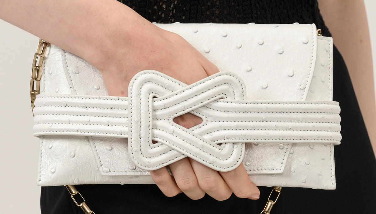 Hands shaping the sculpted knot